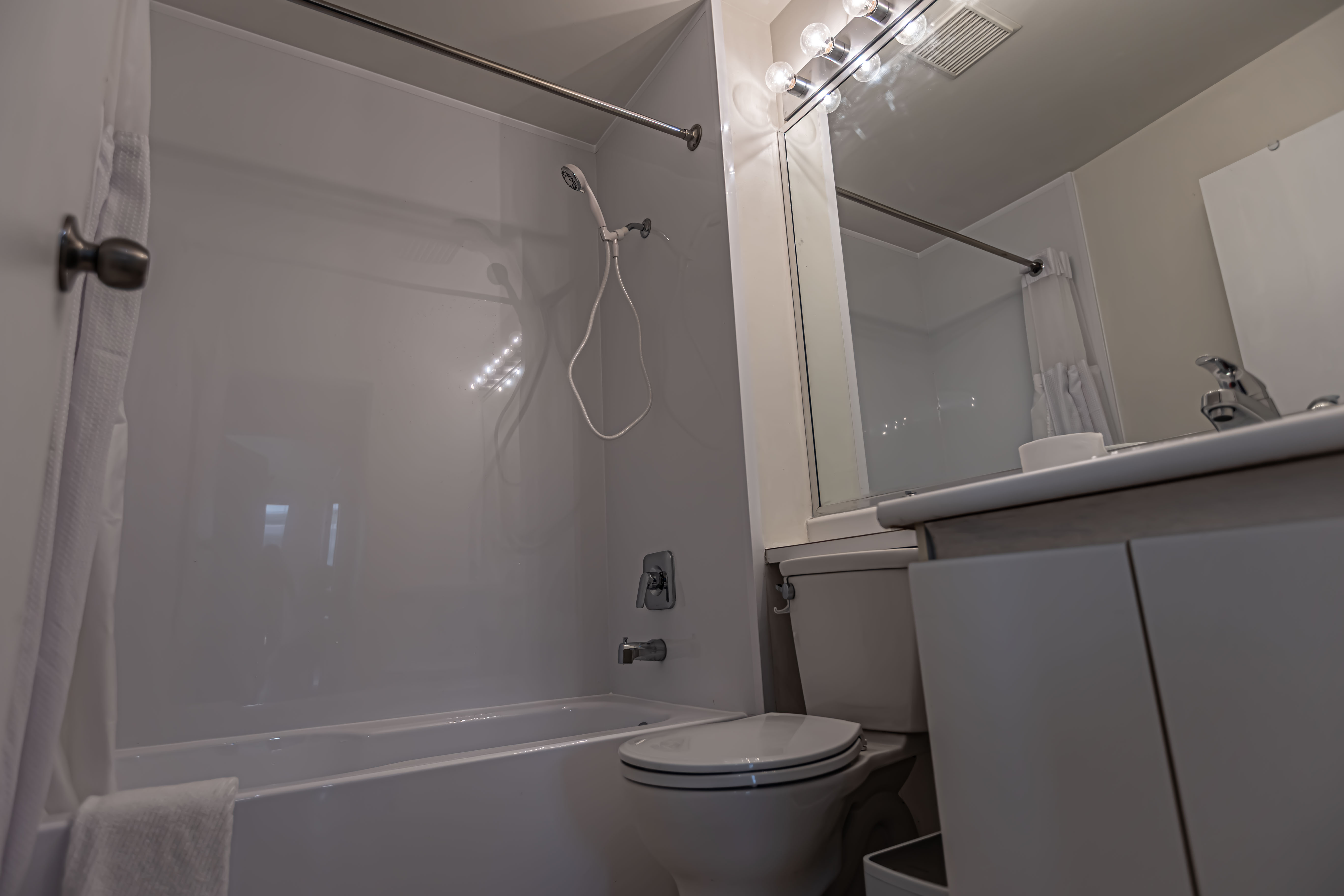 The bathroom with bathtub and shower